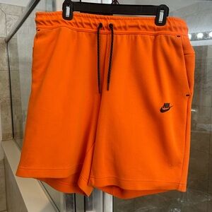 Nike orange tech shorts
